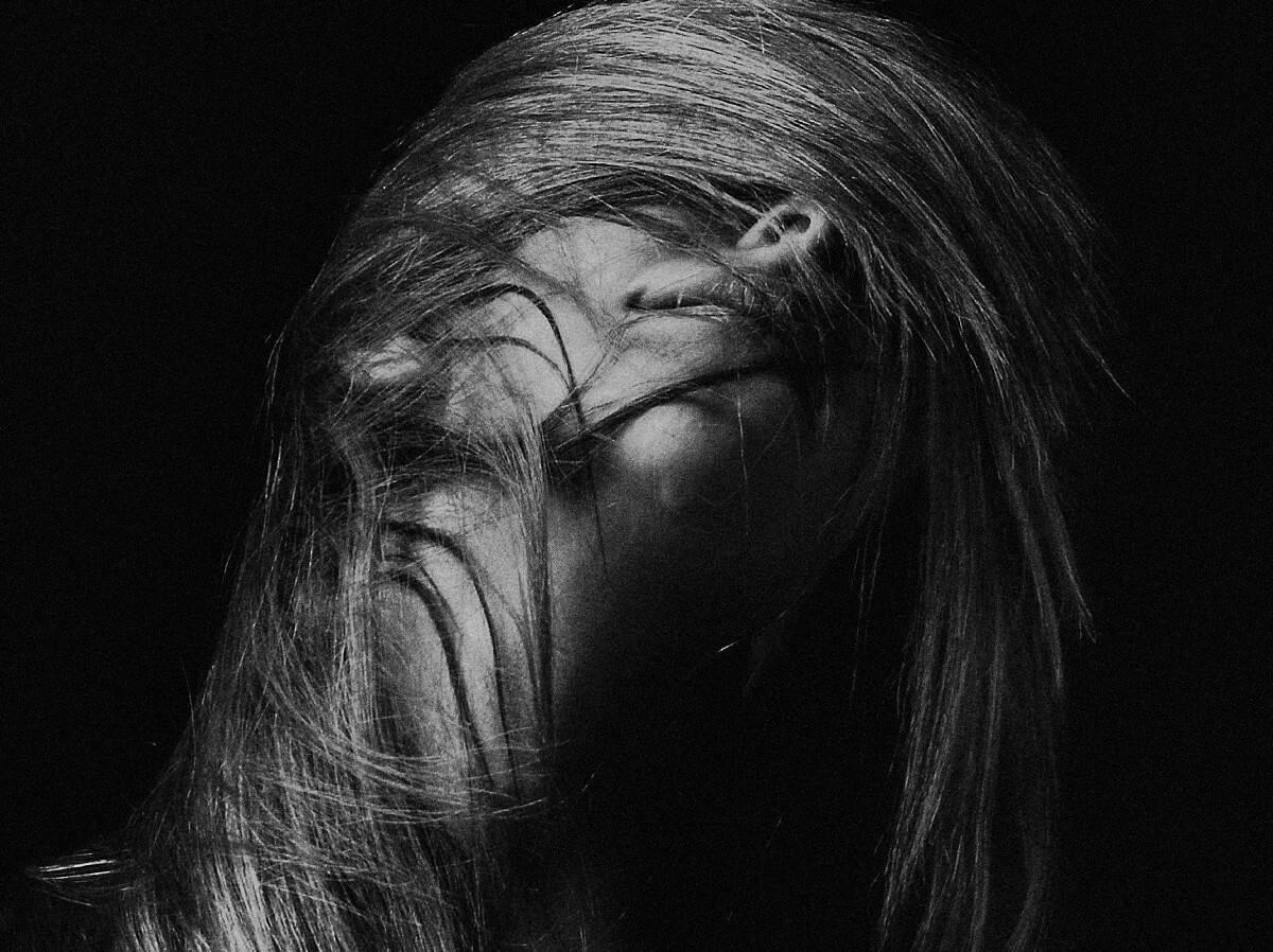 grayscale photography of woman's face