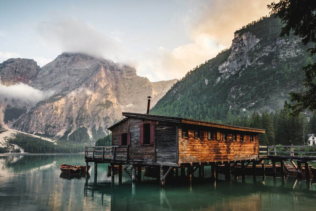 brown wooden house on the lake